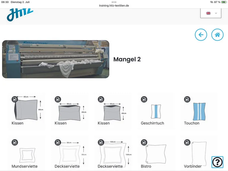 Worxcamera zeigt online ein Foto der Mangel und Piktogramme der Textilien, die damit bearbeitet werden.